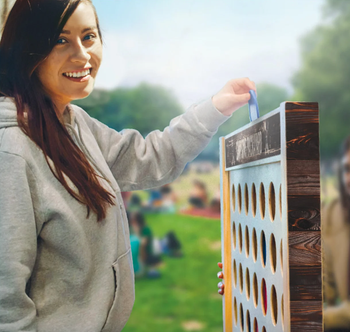 model putting a blue disc into the giant game