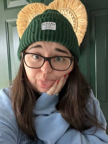 buzzfeed editor wearing an olive green beanie from the strand