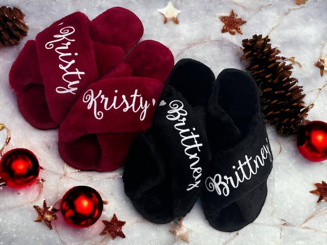 a red pair of fuzzy open toe slippers with the name 