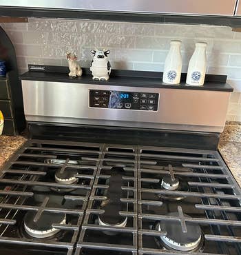 reviewer image of the black stove shelf on a stove