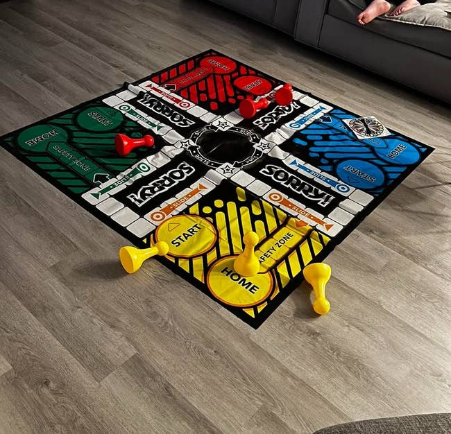 reviewer image of the giant sorry game laid out on the floor