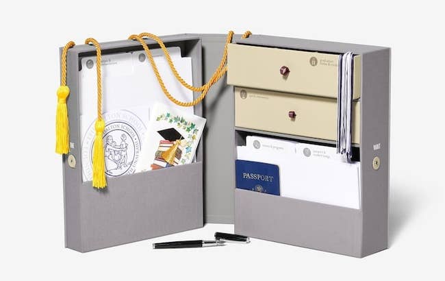 The open keepsake box showing assorted organization boxes and folders with labels 