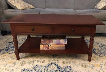 a reviewer photo of the coffee table in dark walnut 