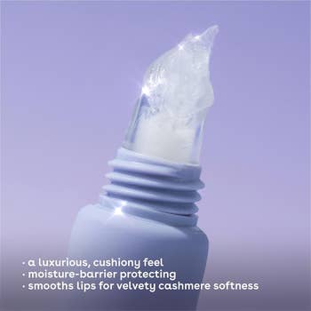 Close-up of a glossy lip balm tube with text: