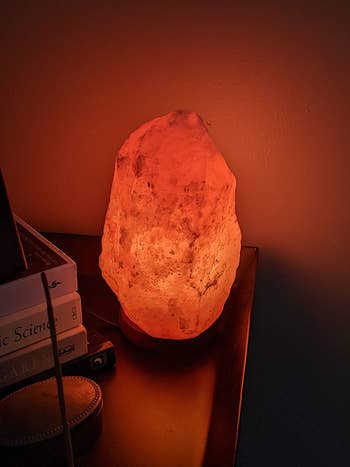 reviewer photo of a lit rock salt lamp