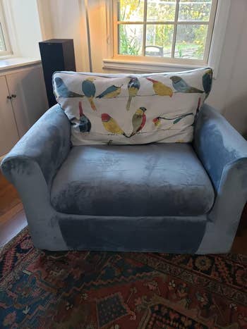 reviewer image of a large chair in a velvet stone blue slipcover