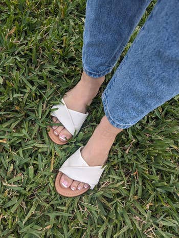 reviewer wearing the white sandals
