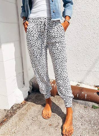 model wearing the pants in white leopard print