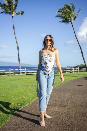 front view of a reviewer wearing the jeans in a light wash