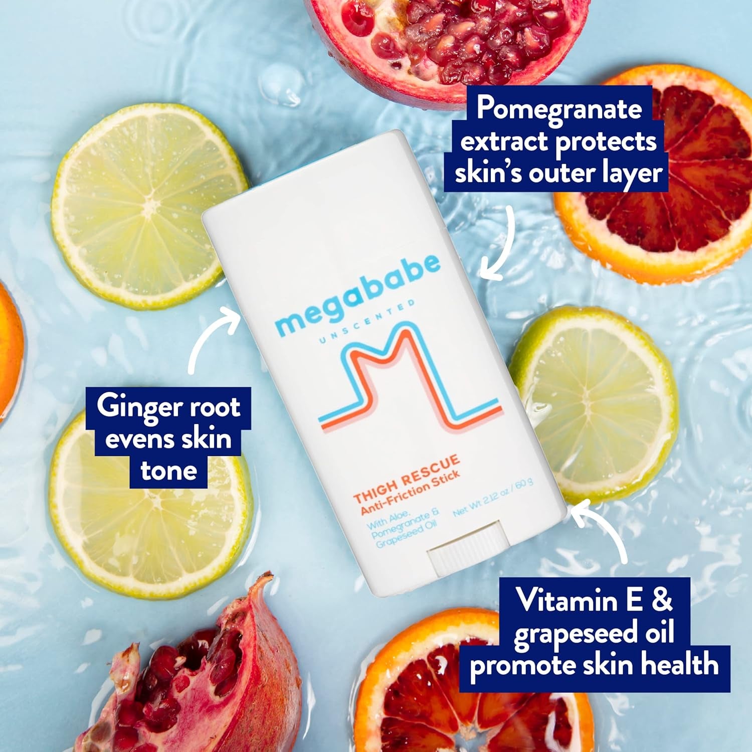 Megababe Thigh Rescue with key ingredients highlighted amidst citrus fruit slices and pomegranate