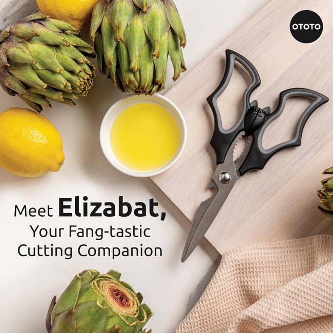 Advertisement for Elizabat scissors, styled similar a bat, with artichokes, a lemon, and olive oil