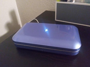 reviewer photo of a closed blue phonesoap case being used