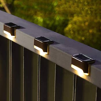 the lights attached to a deck railing