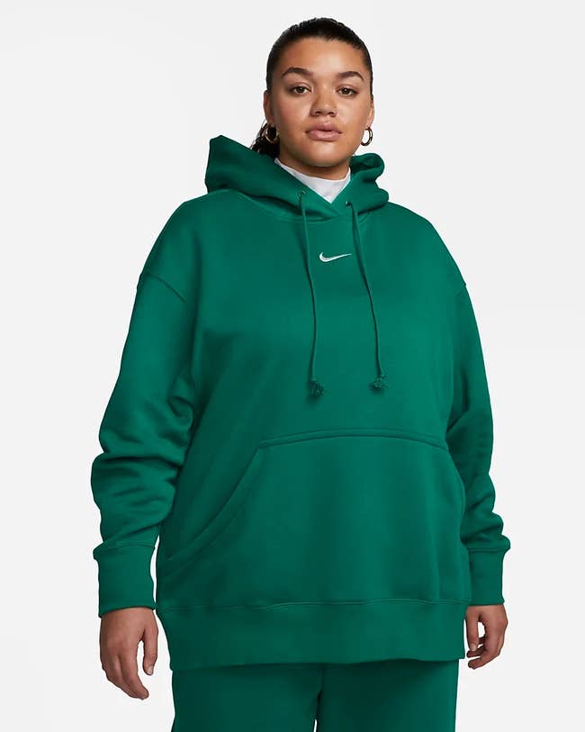 model wearing the oversized hoodie in green