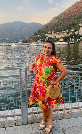 BuzzFeed editor in gold Birkenstock Arizona sandals