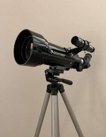a close-up of a reviewer's telescope on a tripod