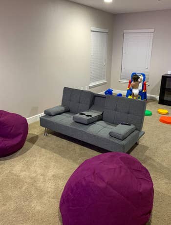 reviewer image of couch in room with carpeting