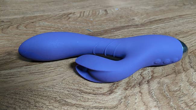 Purple vibrator with unique clitoral arm