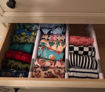 reviewer's underwear drawer sorted into three sections using the dividers