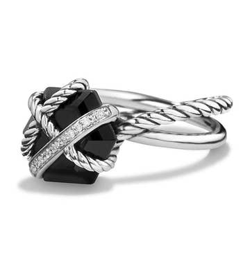 the ring that has a black onyx at the center with diamond and rope bands crossing over