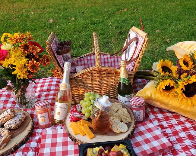 Reviewer photo of the picnic basket surrounded by various snacks 