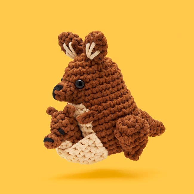 Crocheted toy kangaroo with joey in pouch