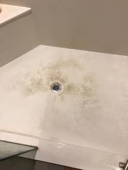 a reviewer's shower floor dirty 