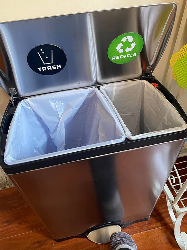 Close up of the trash can showing the two compartments labeled 