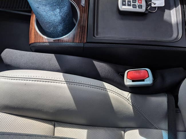 the car seat gap filler installed in a reviewer's car