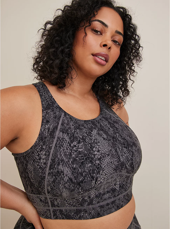 model wearing a gray snake-print longline sports bra