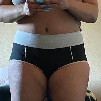 reviewer in black and gray briefs