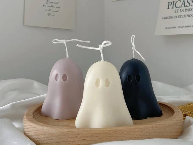 the ghost candles in a light pink, white, and black