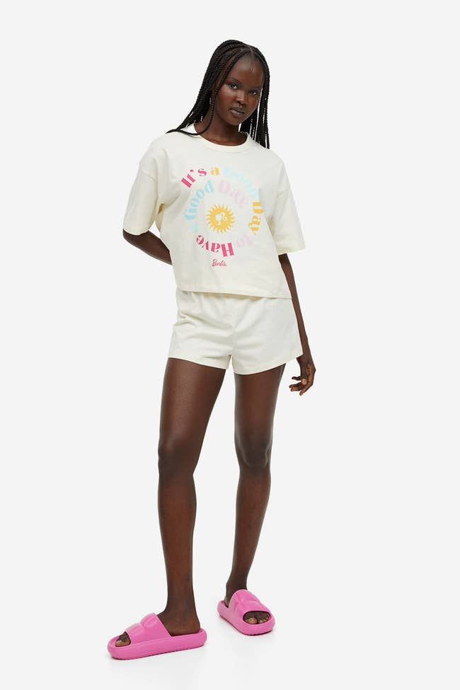 a model in off white pajamas that says 