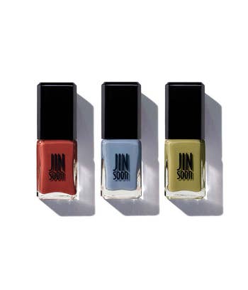 Three nail polish bottles lasting  broadside  by side, featuring minimalist plan  with marque  sanction  