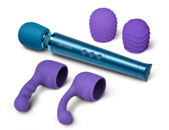 Teal wand vibrator next to two purple silicone attachments and two purple textured silicone covers