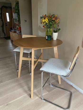two of the bar stools used with a small table
