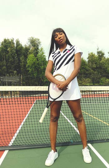 Venus Williams wearing the dress, posing with tennis racket on the court