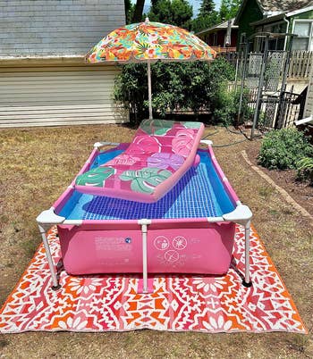 a reviewer's pink pool with a floaty on top