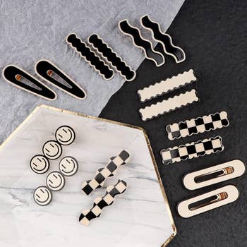 Assorted black and white hair clips and clasps