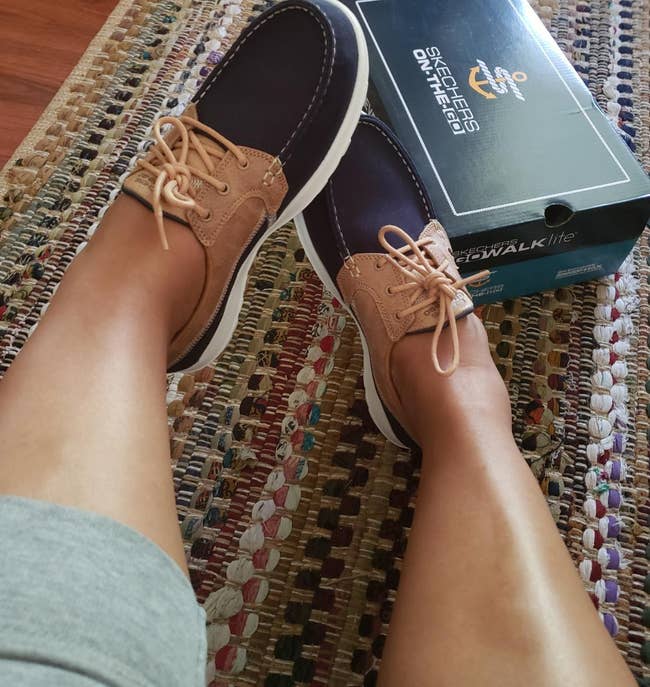 Reviewer photo of the navy blue and tan boat shoes