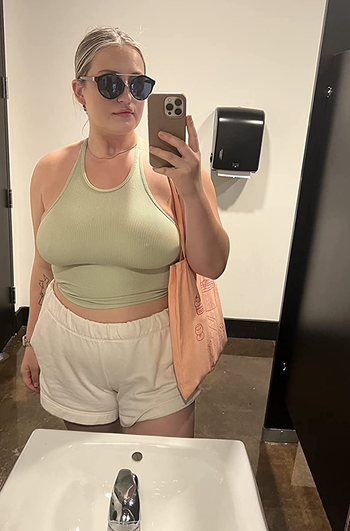 reviewer in the olive green tank