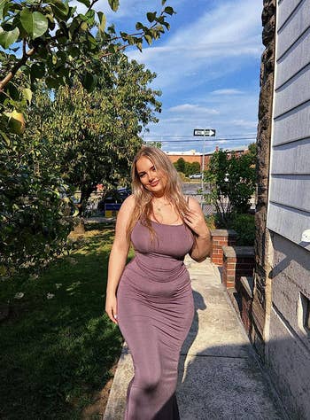 reviewer posing in mauve bodycon maxi dress