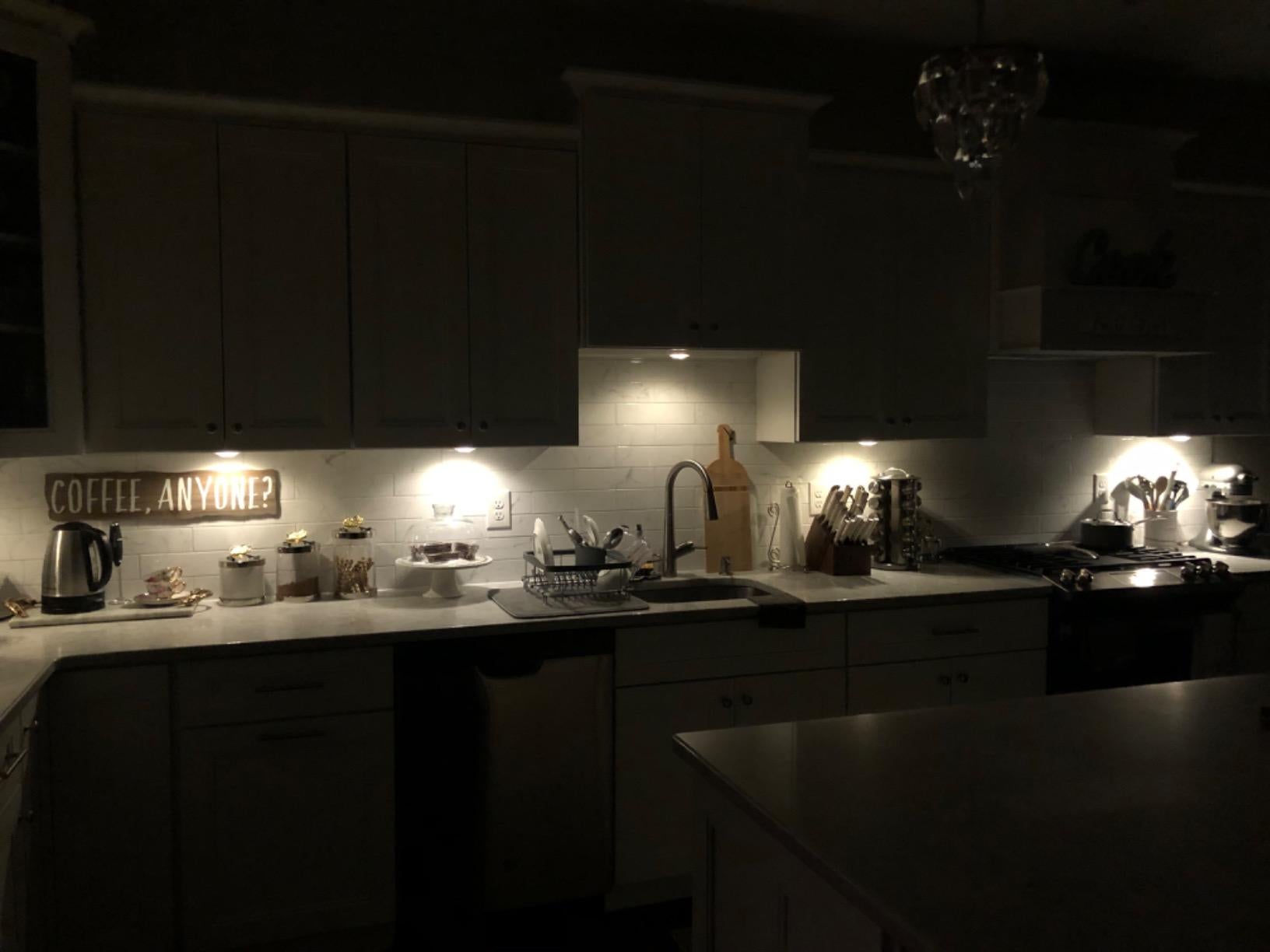 reviewer's kitchen with the puck lights underneath the cabinets