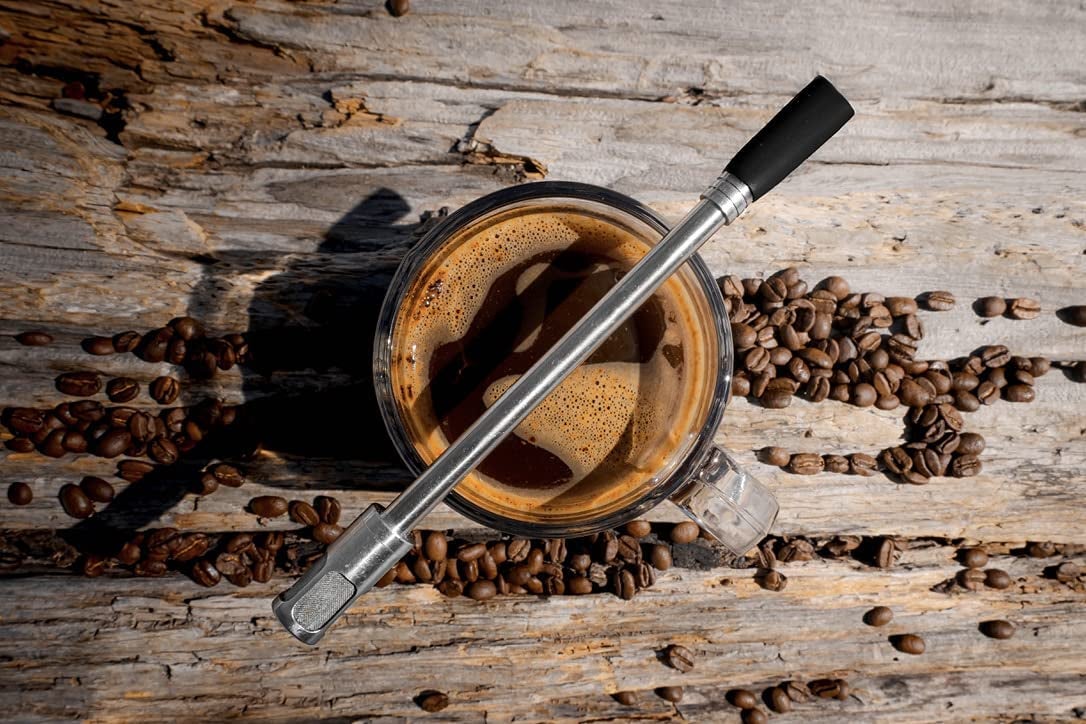 the straw balanced on a mug of coffee