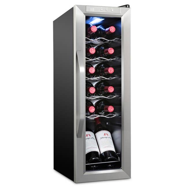 A small silver wine fridge 