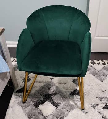 Green velvet armchair with gold legs