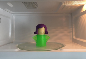 same reviewer's after photo of the angry mama in a clean microwave