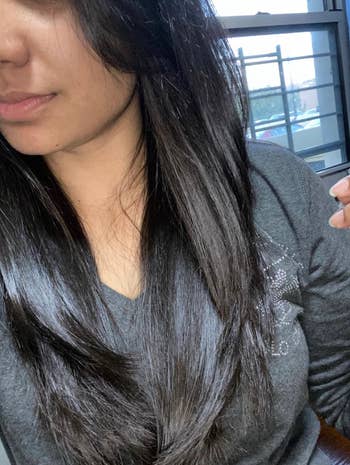 Reviewer with wavy hair soft and shiny after using product