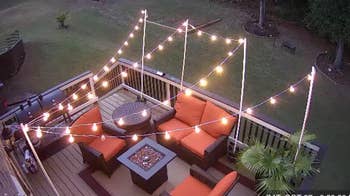 the round bulb string lights over a reviewer's patio