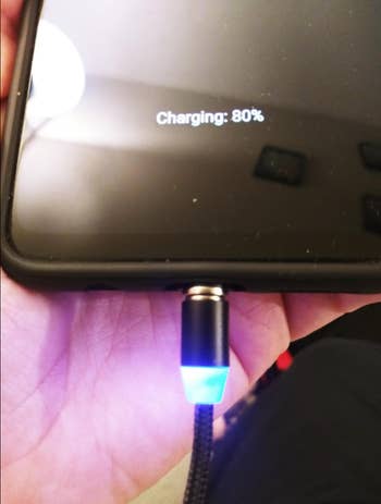 Reviewer image of a phone being charged